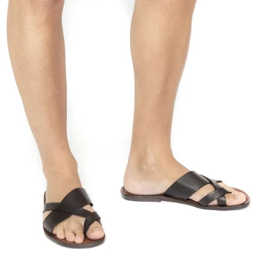 Handmade brown leather thongs braid around the big toe and leather sole