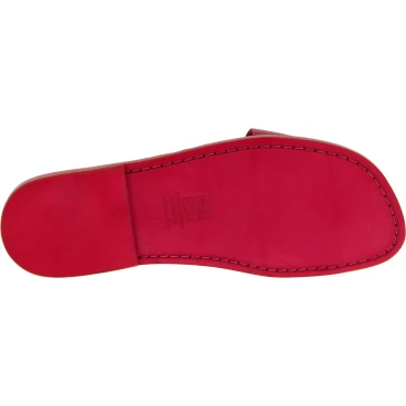 Red leather thongs braid around the big toe and leather sole