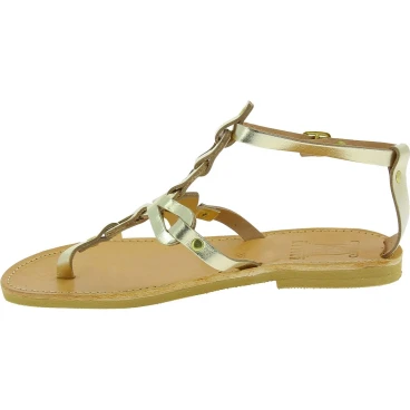 Women's thong sandals with handmade crossed laces in gold laminated calfskin