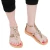 Women's thong sandals with handmade crossed laces in gold laminated calfskin