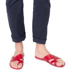 Red leather thongs braid around the big toe and leather sole